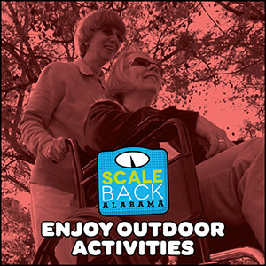 Image of a person pushing someone in a wheelchair